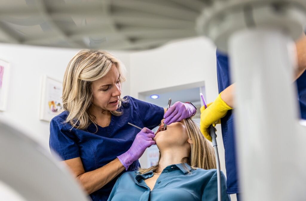 Dentist and assistant at work in the Icon Dental Center treatment room