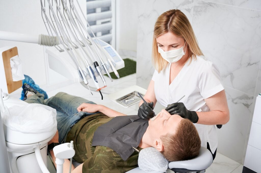 Orthodontist checking a patient's braces at Icon Dental Center in Everett