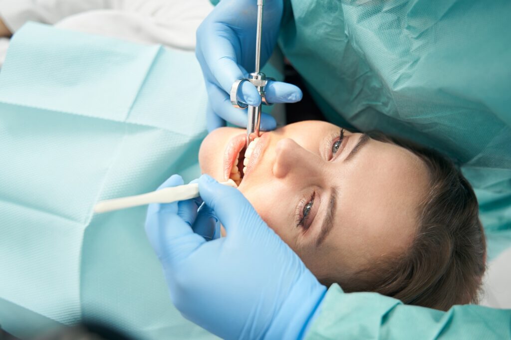 Patient having a tooth examined at Icon Dental Center in Everett